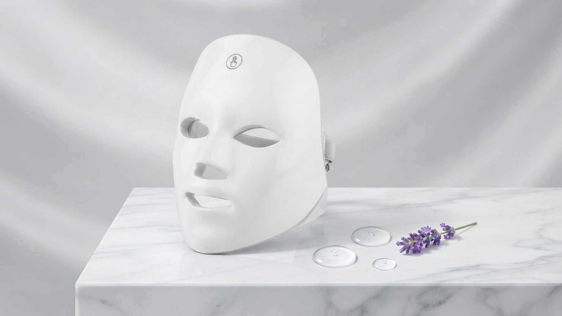 SkiNari LED mask on marble with lavender